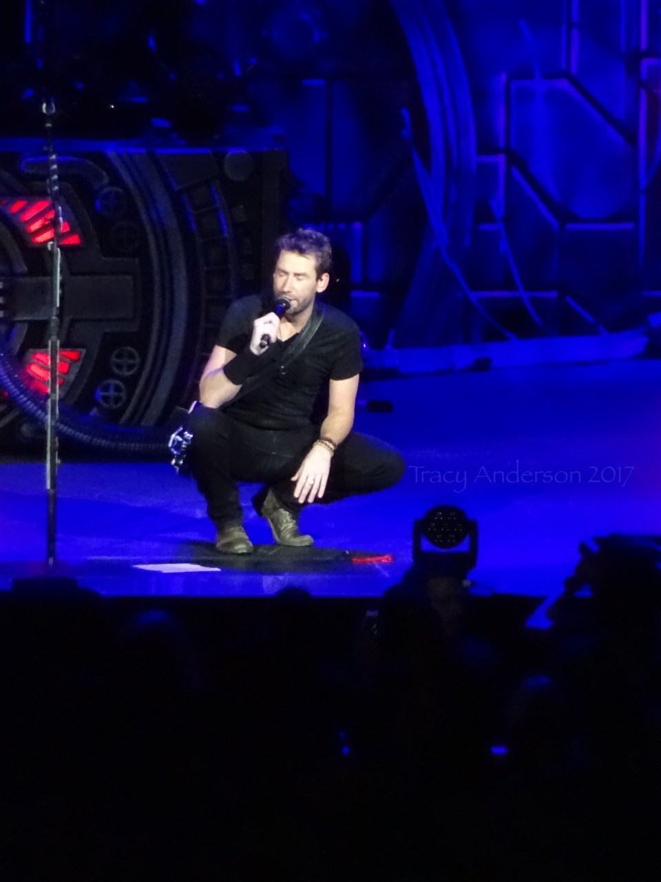 Chad Kroeger of Nickelback kneeling Rogers Place Edmonton Sept 28 2017