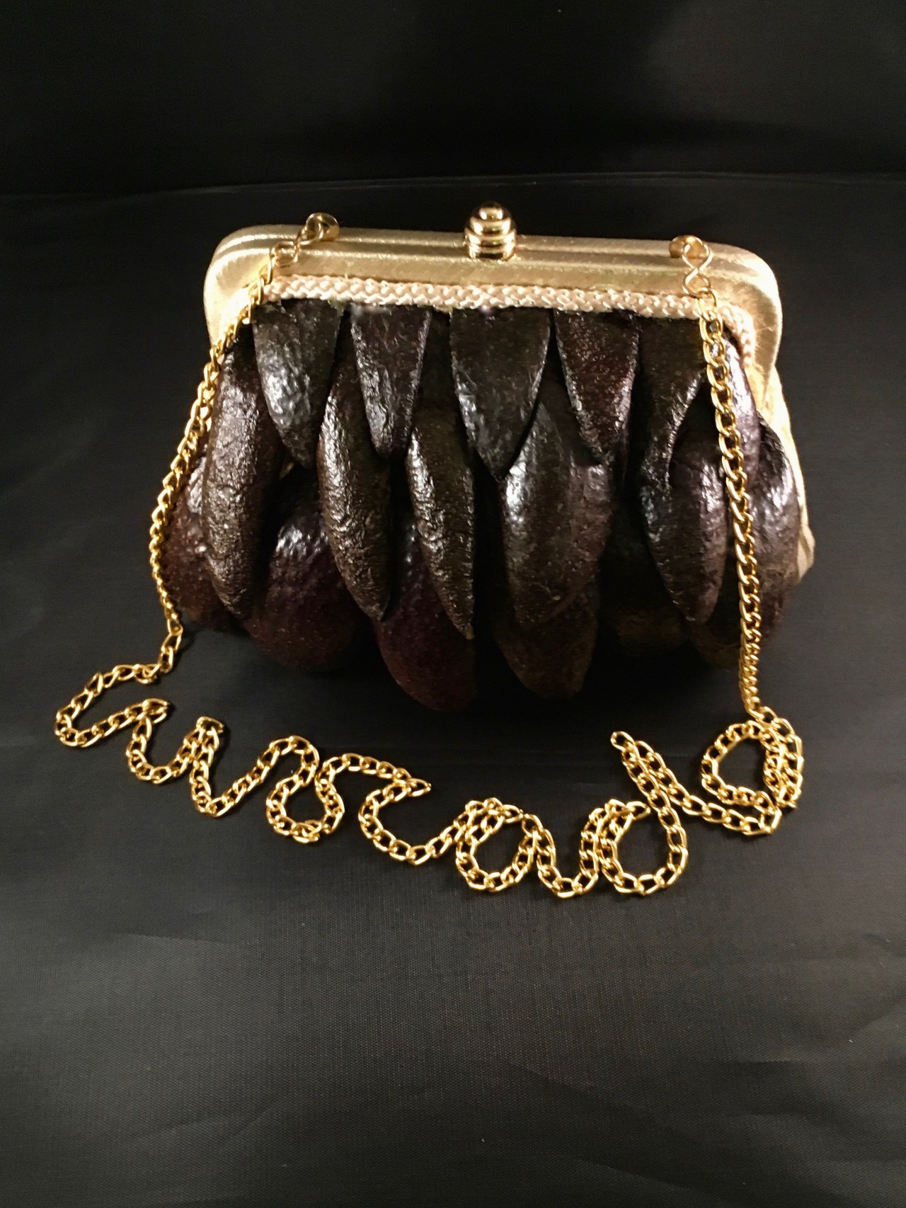 GISH 2019 Item #176 avocado skin purse. By Tracy Anderson