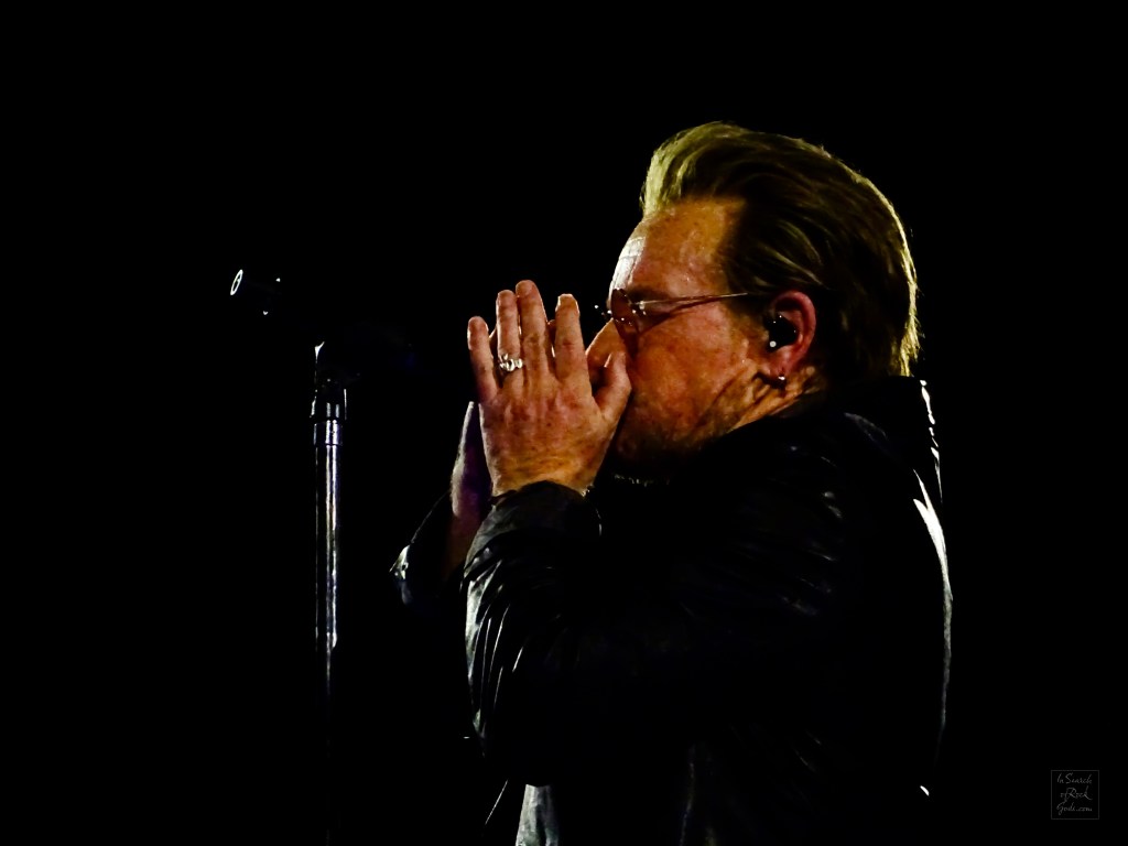 A close up photo of Bono playing the harmonica at the U2:UV Achtung Baby at the Sphere concert in Las Vegas March 1, 2024. 