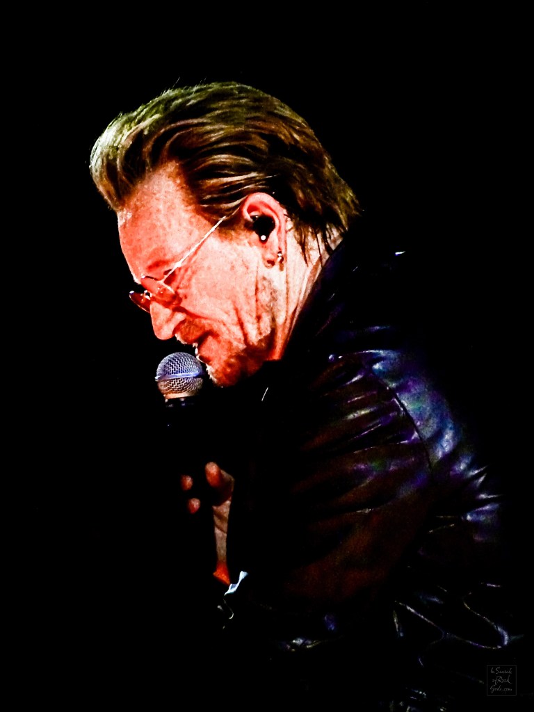 A close up profile photo of Bono singing at the U2:UV Achtung Baby at the Sphere concert in Las Vegas March 1, 2024. 