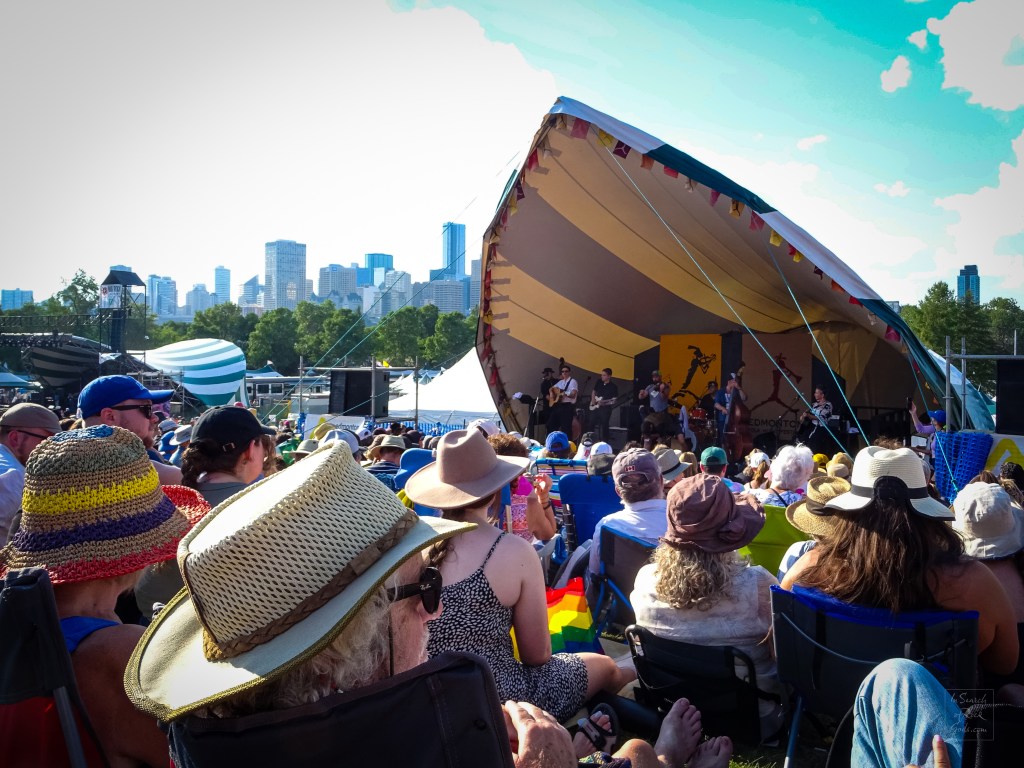 Folk Fest stage, with audience and Edmonton skyline Edmonton Folk Fest 2024