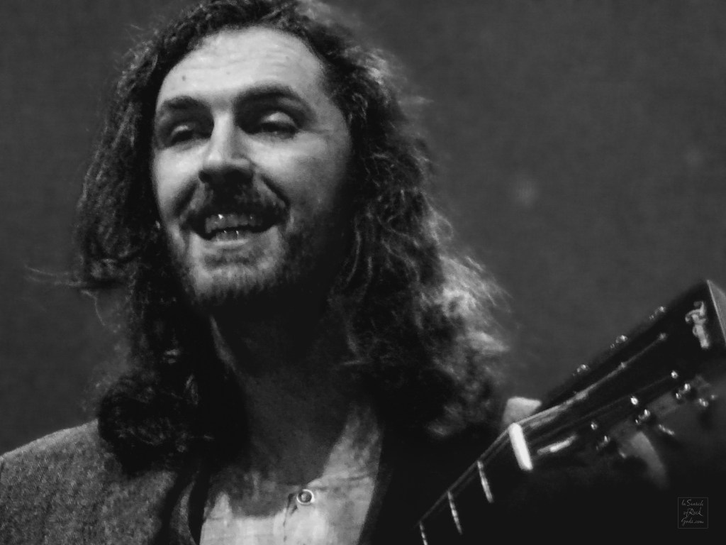 A black and white photo of Hozier in concert. Unreal Unearth Tour Rogers Place Edmonton August 24, 2024