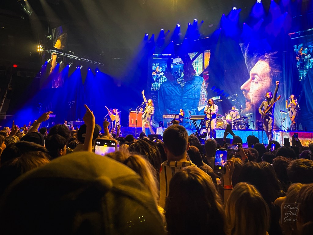 A photo of Hozier in concert and the audience. Unreal Unearth Tour Rogers Place Edmonton August 24, 2024