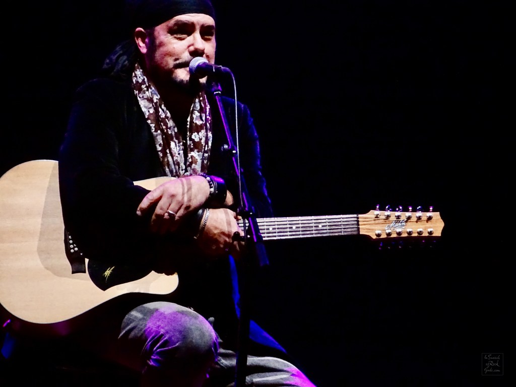 Close up of Jeff Martin sitting with Guitar at the Northern Alberta Jubilee Auditorium