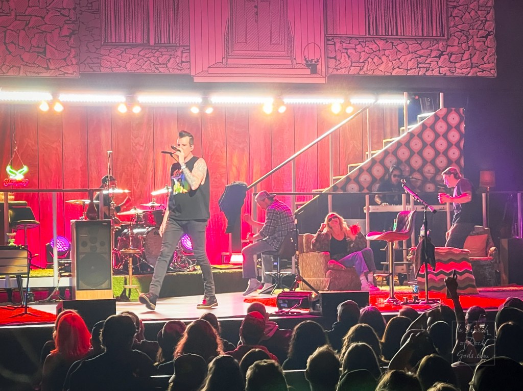 Three fans hangin out on stage with Theory of a Deadman at Northern Alberta Jubilee Auditorium