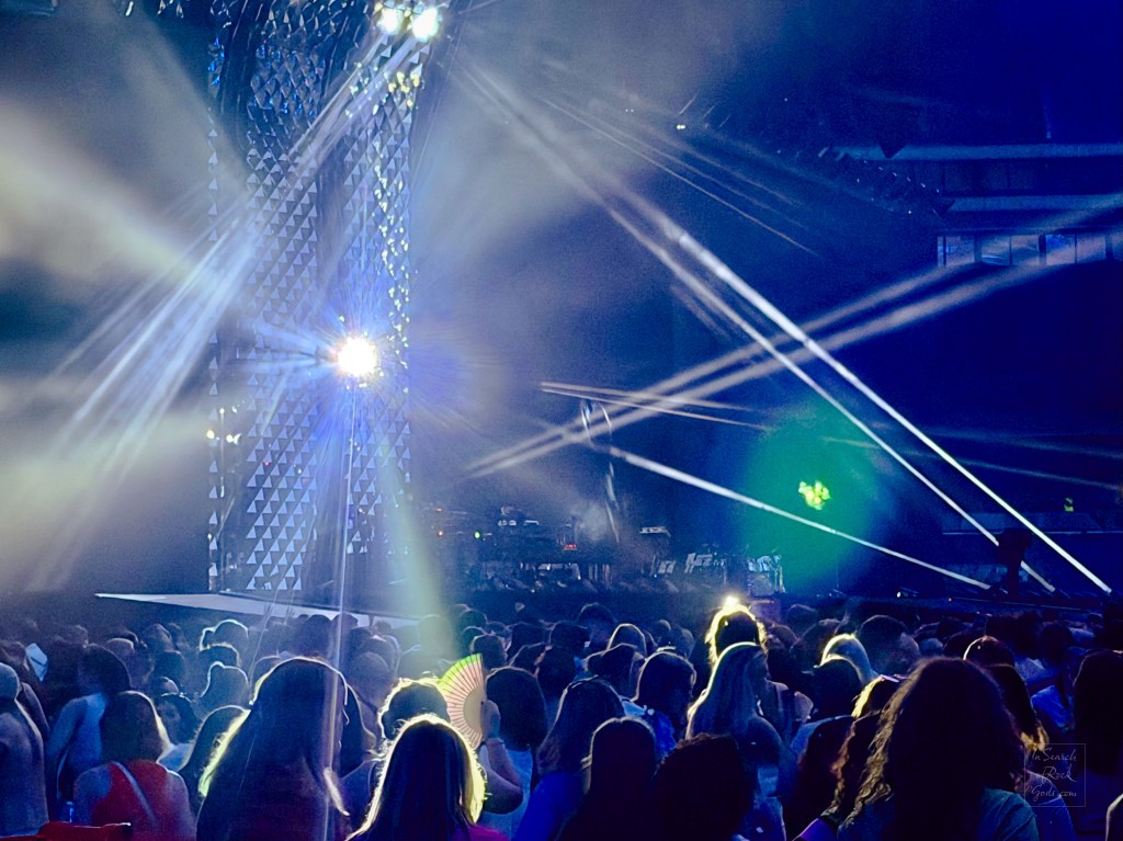 Lights from the stage highlighting a rainbow handfan Harry Styles Together Together Wembley N5 June 20 2026
